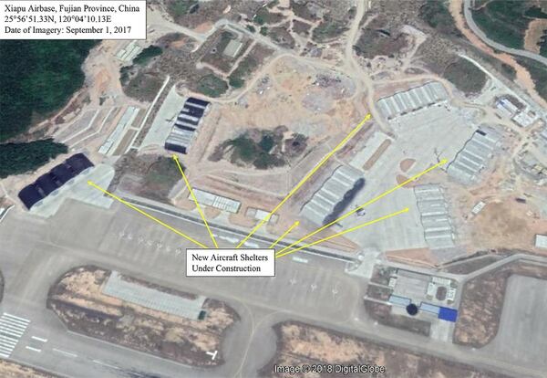 A satellite photo of Xiapu airbase dated September 2017 showing the aircraft shelters being built. More recent satellite photos show these are close to completion. (Google, with annotation by Mike Yeo/Staff)