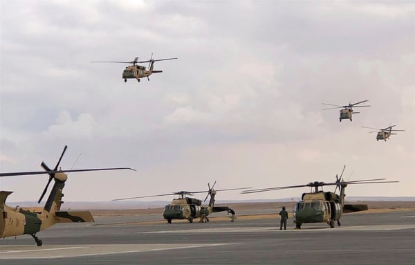 Black Hawk helicopters were featured in a hostage rescue drill at a Jordanian military base near the town of Zarqa, Jordan, Sunday, Jan. 28, 2018. Jordan marked the delivery of 12 U.S. Black Hawk helicopters over the past nine months with a military ceremony, including a drill and a flyover. (Muntasser Akour/AP)