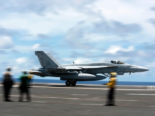 An F/A-18E Super Hornet practices a touch-and-go maneuver on the flight deck of the aircraft carrier USS Ronald Reagan (CVN 76) on June 10, 2020, in the Philippine Sea. (MC2 Samantha Jetzer/U.S. Navy via AP)
