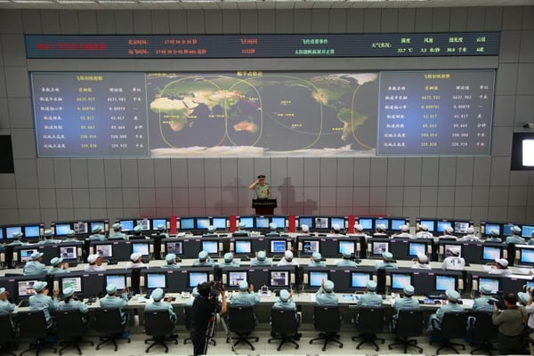 Chinese chief mission commander Zhang Youxia, center, salutes after he announced the successful launch of the Shenzhou-10 on June 11, 2013. (AFP/Getty Images)