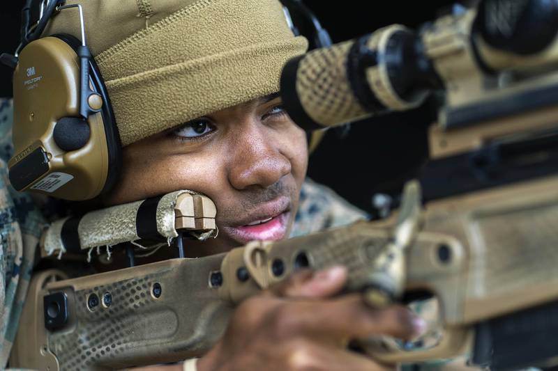 U.S. Marine Corps Lance Cpl. Jeremiah Riley-Caldwell fires an Mk13 Mod7 sniper rifle on Jan. 28, 2021, during a pre-sniper qualification course at Camp Hansen, Okinawa.