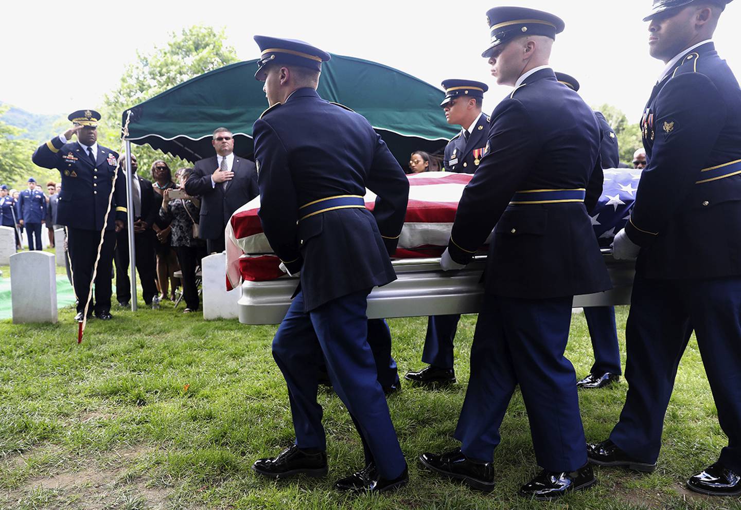 Superintendent Darryl Williams, back left, salutes as the Military honor guard carry the casket of West Point Cadet Christopher J. Morgan, during the interment ceremony at West Point, N.Y.