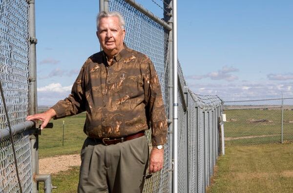 In this Sept. 26, 2017 photo, Bob Hicks stands at the former site of a nuclear missile silo near Vale, S.D., where he responded to an accident in 1964. None of the accidents suffered by the nation's nuclear-weapons program has ever caused a nuclear detonation. That there was not a detonation at Lima-02 in 1964 is an indication of the safety and reliability of the Minuteman missile program, according to Hicks, who did not sour on nuclear weapons after the accident. (Hannah Hunsinger/Rapid City Journal via AP)