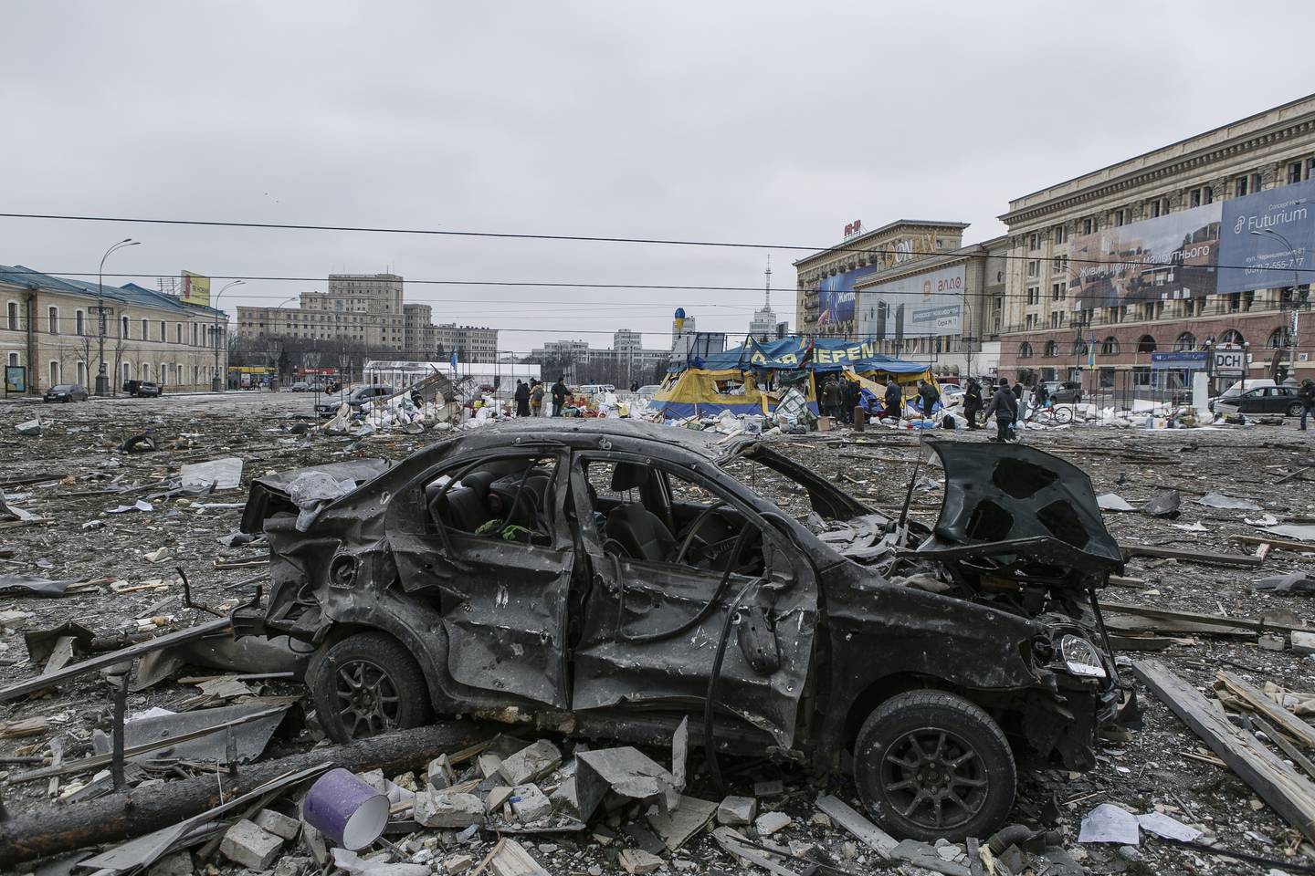 A view of the central square following shelling of the City Hall building in Kharkiv, Ukraine, Tuesday, March 1, 2022. Russia on Tuesday stepped up shelling of Kharkiv, Ukraine's second-largest city, pounding civilian targets there. Casualties mounted and reports emerged that more than 70 Ukrainian soldiers were killed after Russian artillery recently hit a military base in Okhtyrka, a city between Kharkiv and Kyiv, the capital. (AP Photo/Pavel Dorogoy)
