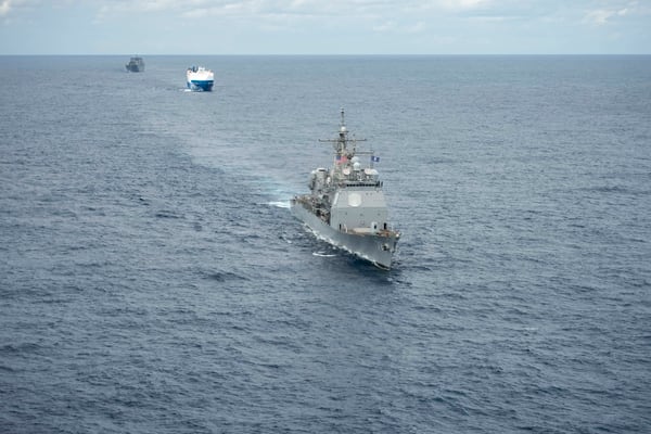 A convoy complied of the Ticonderoga-class guided-missile cruiser Vella Gulf on Feb. 28. (MC3 Andrew Waters/Navy)