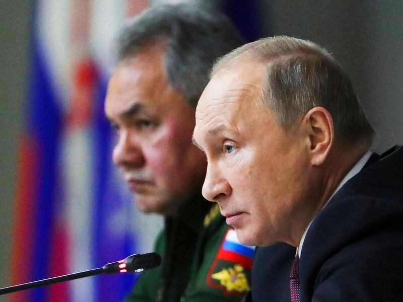 Russian President Vladimir Putin, foreground, Russian Defence Minister Sergei Shoigu, attend a meeting while visiting the Military Academy of Strategic Rocket Troops of the Peter the Great in Balashikha, outside Moscow, Russia, Friday, Dec. 22, 2017. (Mikhail Klimentyev, Sputnik, Kremlin Pool Photo via AP)