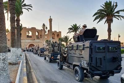Vehicles of the "Tripoli Brigade," a militia loyal to the UN-recognized Government of National Accord (GNA), parade through the Martyrs' Square at the center of the GNA-held Libyan capital Tripoli on July 10, 2020