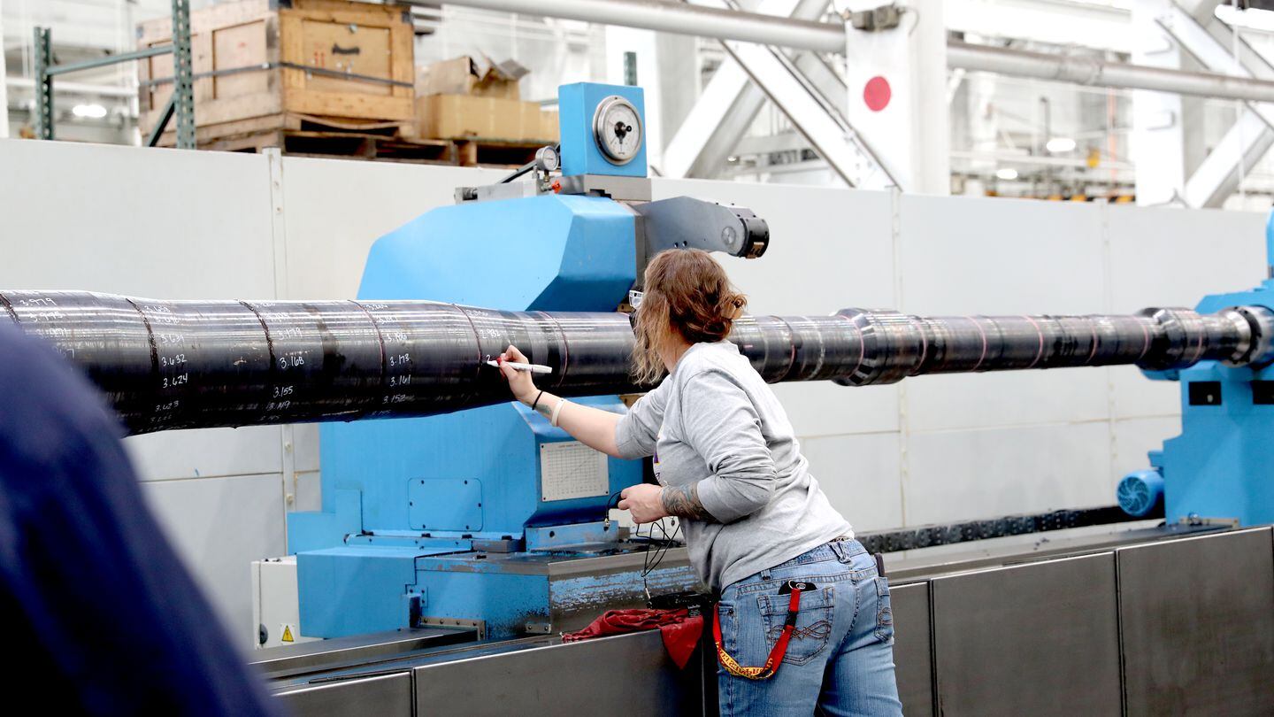 Lisa Sheldon, a Watervliet Arsenal machinist, prepares a cannon destined for an M1 Abrams tank on one of the recently installed hollow spindle lathes. The lathes are capable of machining longer cannon and artillery systems. (Watervliet Arsenal)