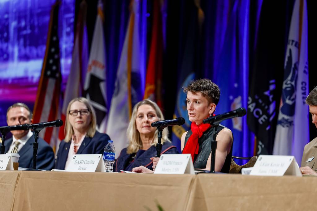 Caroline Baxter, deputy assistant secretary of defense for force education and training, speaks on a panel of senior military leaders at the annual Interservice/Industry Training, Simulation and Education Conference in Orlando, Fla., on Nov. 29, 2022. (Photo courtesy of the National Defense Industrial Association)