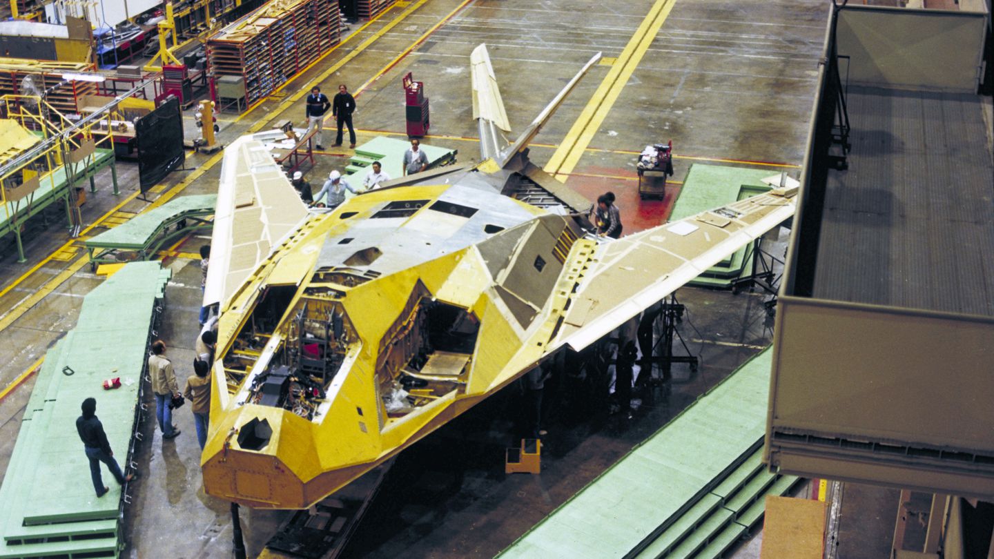 An F-117 Nighthawk stealth attack aircraft undergoes assembly at a Lockheed Martin facility around 1980. (Lockheed Martin)
