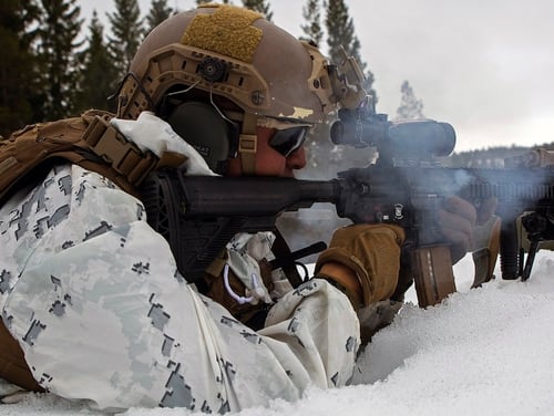 A Marine with Marine Rotational Force-Europe 18.1 sends live rounds down range while conducting a squad attack during winter warfare training at Haltdalen Training Center, Norway, April 18, 2018. (Gunnery Sgt. Clinton Firstbrook/Marine Corps)