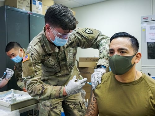 Command Sgt. Maj. Alex Kupratty of the 4th Infantry Brigade, 25th Infantry Division, receives his initial dose of the Pfizer COVID-19 vaccine Jan. 6 at Joint Base Elmendorf-Richardson in Alaska. (Maj. Jason Welch/Army)