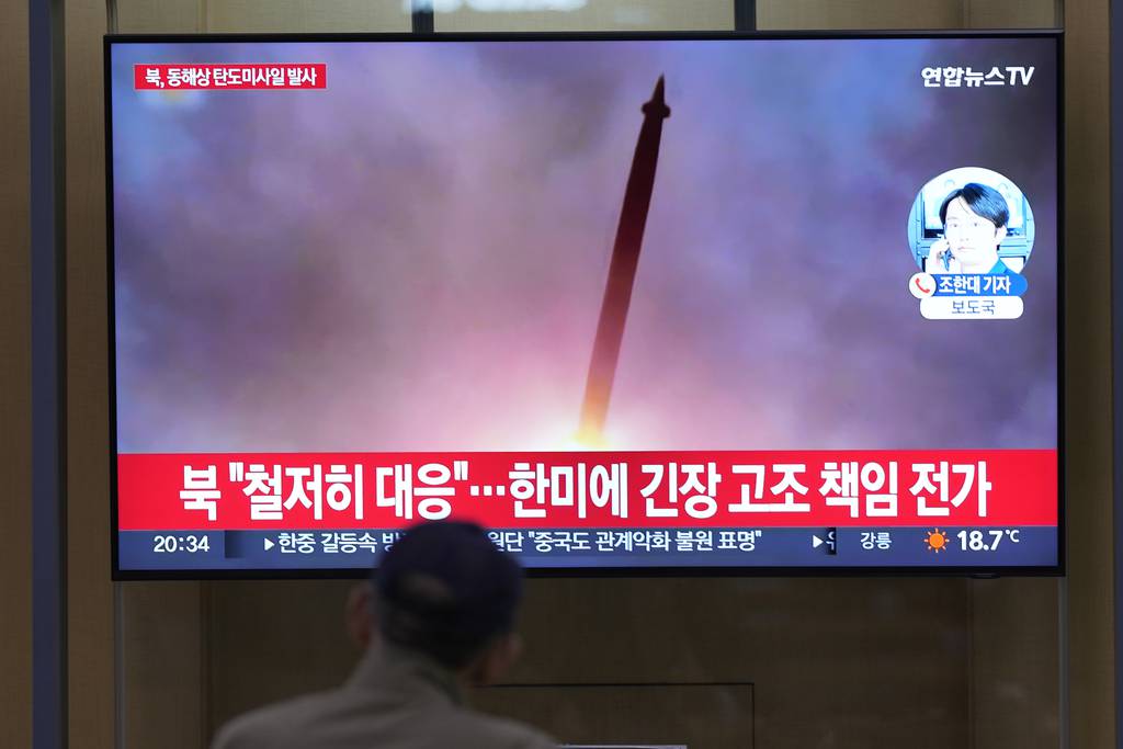 A TV screen shows a report of North Korea's missile launch with file image during a news program at the Seoul Railway Station in Seoul, South Korea, Thursday, June 15, 2023.