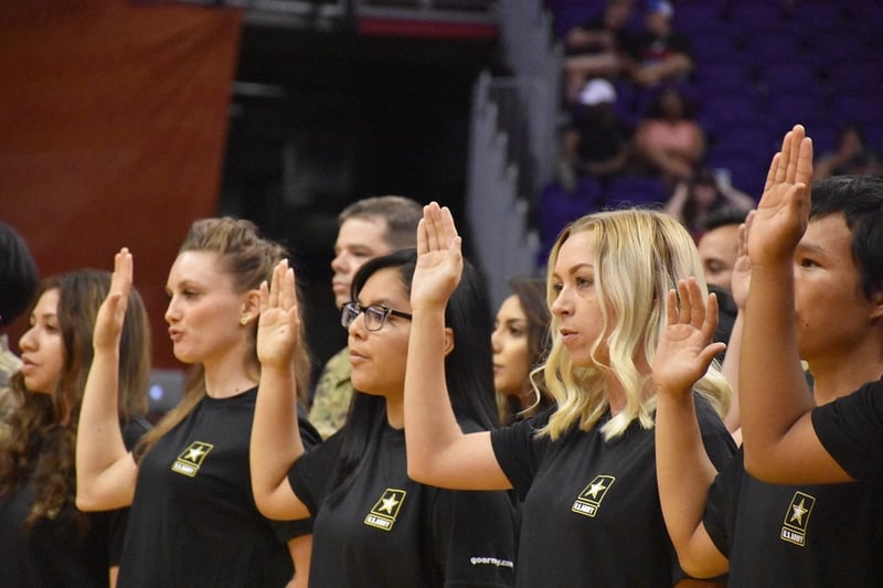 Army recruits participate in a mass oath of enlistment ceremony during half-time of the Phoenix Mercury and Las Vegas Aces Women’s National Basketball Association game on July 19 in Phoenix. (Alun Thomas/Army)