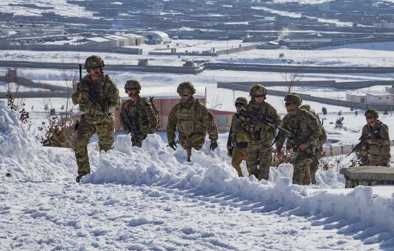 U.S. soldiers hike up a snow-covered hill to take part in a key leader engagement Jan. 16, 2020, in southeastern Afghanistan.