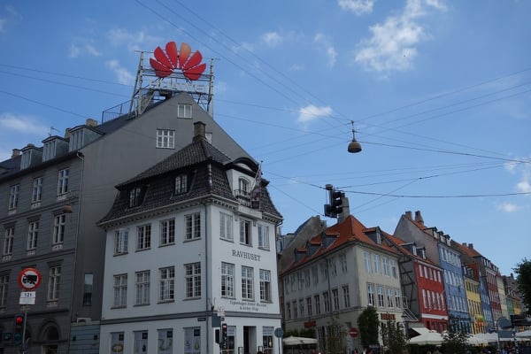 A massive advertisement for Chinese giant Huawei guarding the entrance to Copenhagen's popular Nyhavn district is a testament to China's investment in Denmark. But officials there worry about national security implications in the future. (Aaron Mehta/Staff)