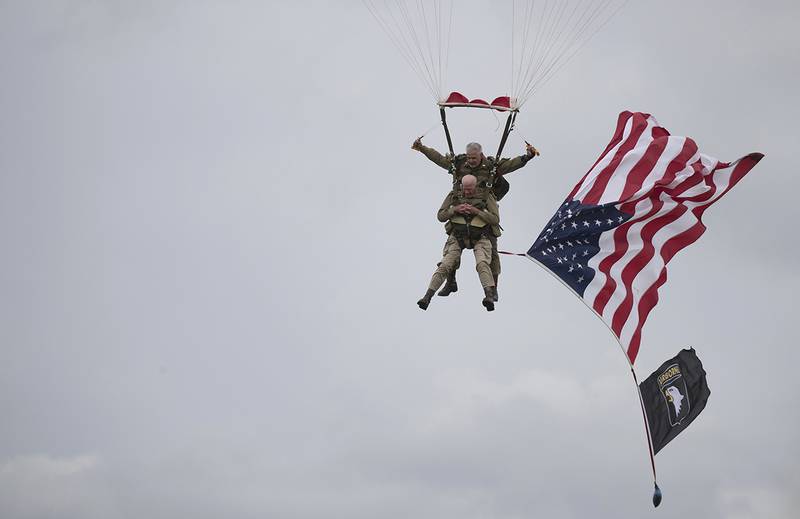 World War II D-Day veteran Tom Rice parachutes in a tandem jump into a field in Carentan, Normandy, France.