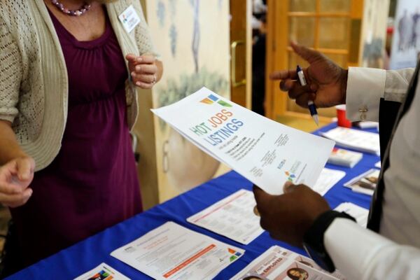 A veteran talks with a hiring specialist during a job fair for veterans in Pembroke Pines, Fla., in October 2015. (Lynne Sladky/AP)