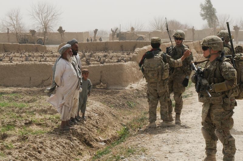 Soldiers from 4th Brigade Combat Team, 82nd Airborne Division, who were not involved in Lorance's platoon but worked in the same district, pull security during a meeting with local Afghan civilians in March 2012. (Army)