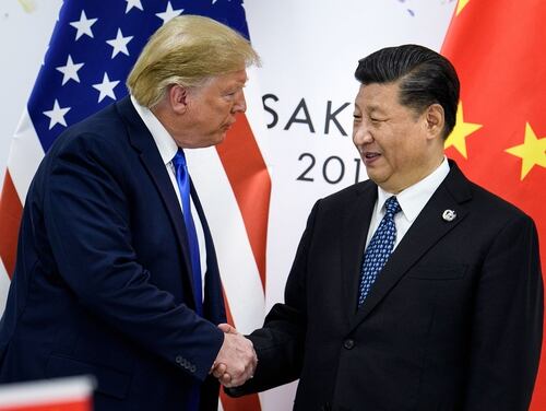 In this file photo taken June 28, 2019, China's President Xi Jinping, right, shakes hands with President Donald Trump before a bilateral meeting on the sidelines of the G20 Summit in Osaka. (Brendan Smialowski/AFP via Getty Images)