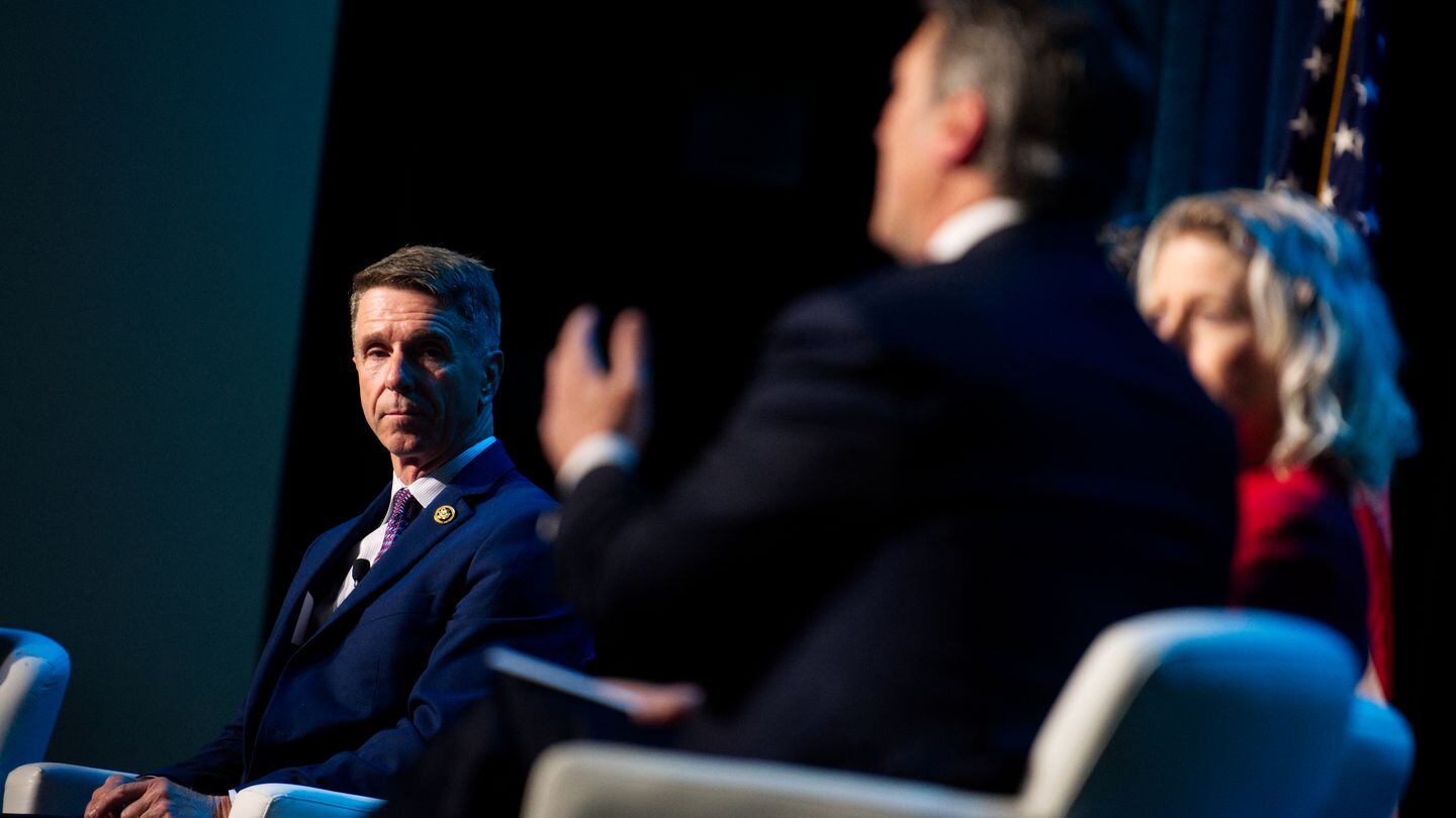 U.S. Rep. Rob Wittman, a Virginia Republican, listens to Rep. Ronny Jackson, a Texas Republican and fellow member of the House Armed Services Committee, during a 2024 Sea-Air-Space discussion. (Colin Demarest/C4ISRNET)