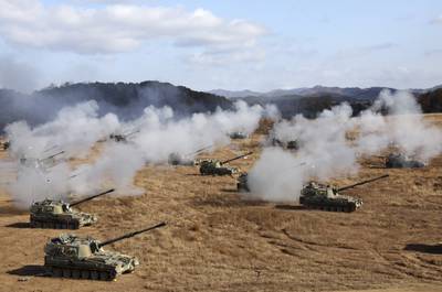South Korean army K-9 self-propelled howitzers and K-55A1 self-propelled howitzers fire during the military drills at a training field in Cheorwon, South Korea, Friday, Oct. 27, 2023.