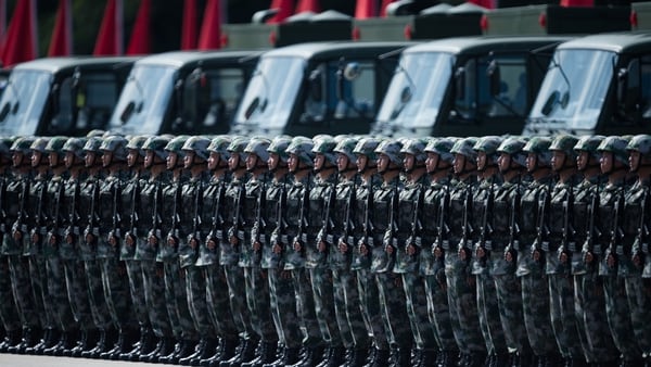 People's Liberation Army soldiers prepare for the arrival of Chinese President Xi Jinping at the Shek Kong barracks in Hong Kong on June 30, 2017. (Dale de la Rey/AFP via Getty Images)