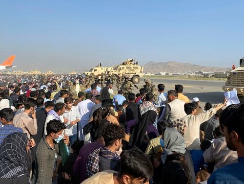 U.S soldiers attempt to hold a perimeter at the international airport in Kabul, Afghanistan, on Aug. 16 as thousands of Afghan nationals seek evacuation from the country. (Shekib Rahmani/AP)