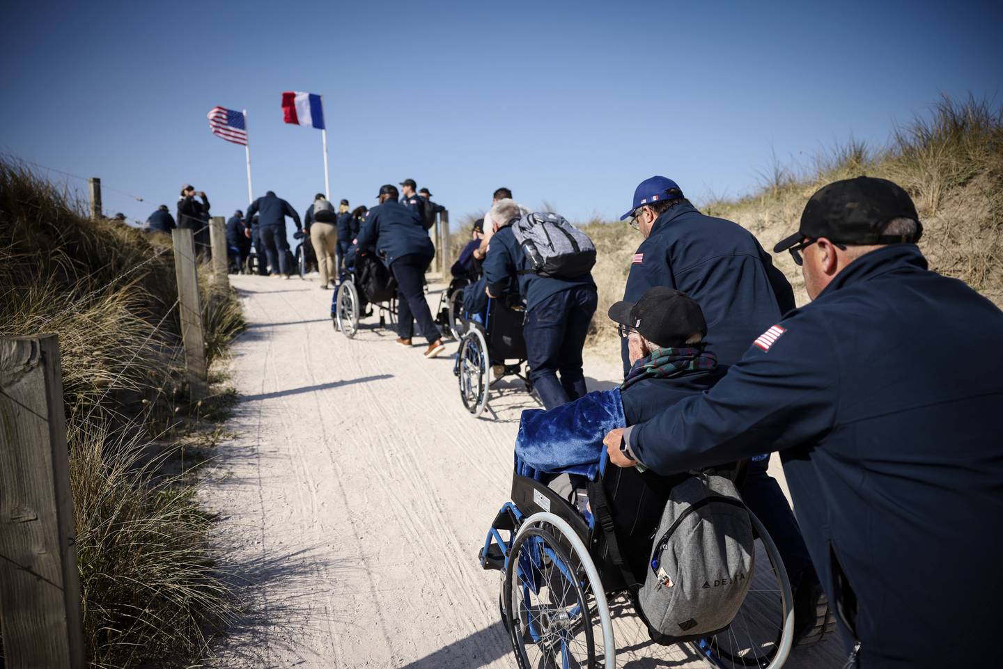 U.S. veterans arrive for the commemoration organized by the Best Defense Foundation at Utah Beach near Sainte-Marie-du-Mont, Normandy, France, Sunday, June 4, 2023, ahead of the D-Day Anniversary.