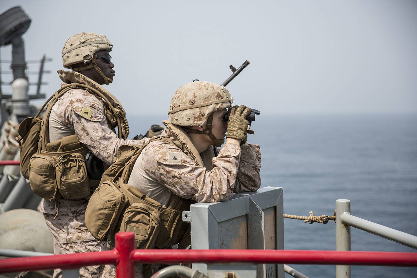 Marines provide security aboard the amphibious dock landing ship USS Harpers Ferry (LSD 49) on July 23, 2019, during a Strait of Hormuz transit.