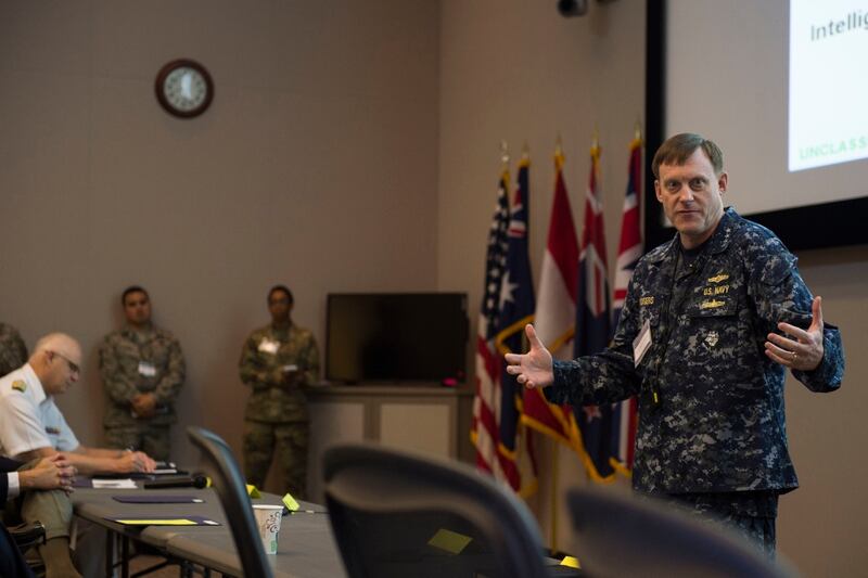 SUFFOLK, Va. (June 16,2016) Navy Adm. Michael S. Rogers, who commands U.S. Cyber Command and also directs the National Security Agency and serves as chief of the Central Security Service, speaks to exercise Cyber Guard 2016 visitors in Suffolk, Va., June 16, 2016. Photo was edited for security considerations (DoD Photo by Navy Petty Officer 2nd Class Jesse A. Hyatt)