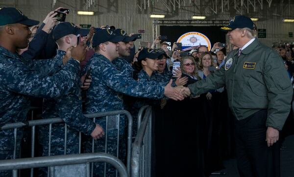 President Donald Trump greets sailors after entering the hangar bay aboard Pre-Commissioning Unit Gerald R. Ford in March. (Mass Communication Specialist 3rd Class Cathrine Mae O. Campbell/Navy)