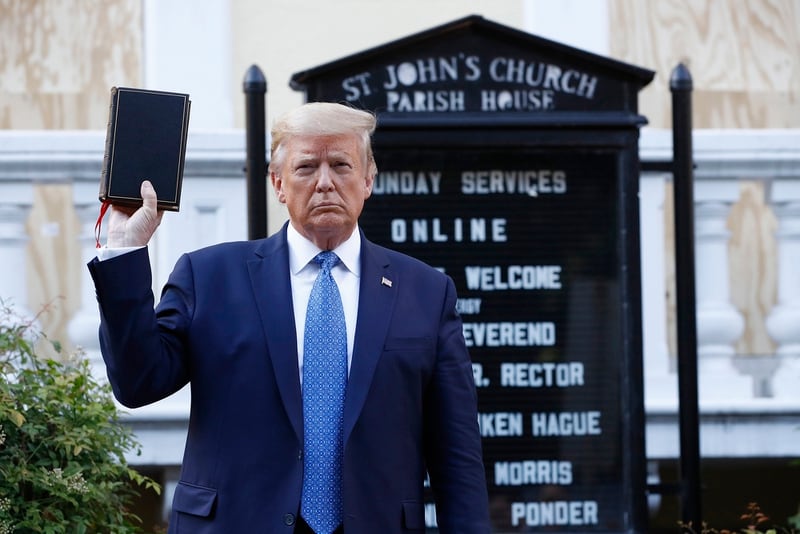 President Donald Trump holds a Bible as he visits outside St. John's Church across Lafayette Park from the White House Monday, June 1, 2020, in Washington. Park of the church was set on fire during protests on Sunday night. (Patrick Semansky/AP)