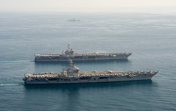 The carriers Dwight D. Eisenhower and Harry S. Truman in the Arabian Sea March 18. (Photo: Navy)