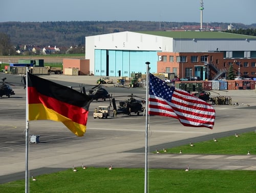 U.S. and German flags fly outside 12th Combat Aviation Brigade Headquarters overlooking the Katterbach Army Airfield in Ansbach, Germany, April 21, 2016. (Spc. Charles Rosemond/Army)