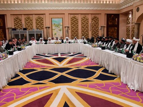 In this Feb. 25, 2019, file photo released by Qatar Ministry of Foreign Affairs, Special Envoy of the Qatar Foreign Minister for Counterterrorism and Mediation in conflicts resolution, Dr. Mutlaq Bin Majid Al-Qahtanithe, mediates talks between the U.S. Special Representative for Afghanistan, Ambassador Zalmay Khalilzad, and the Deputy Commander of the Taliban Movement for Political Affairs, Mulla Abdul Ghani Berader, in an undisclosed place in Doha, Qatar. (Qatar Ministry of Foreign Affairs via AP)