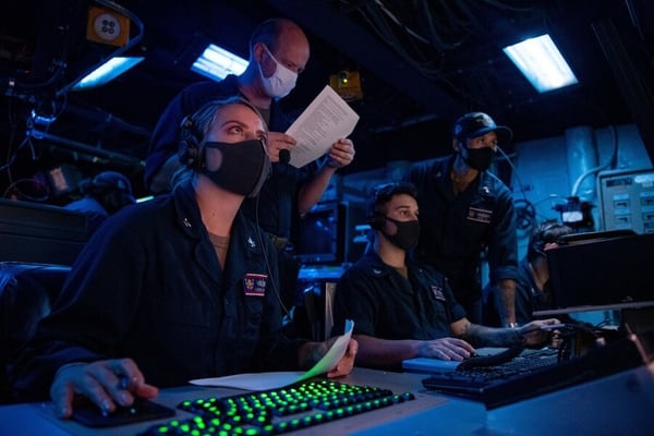 Sailors on the destroyer Barry train on planning a Tomahawk mission. (U.S. Navy)