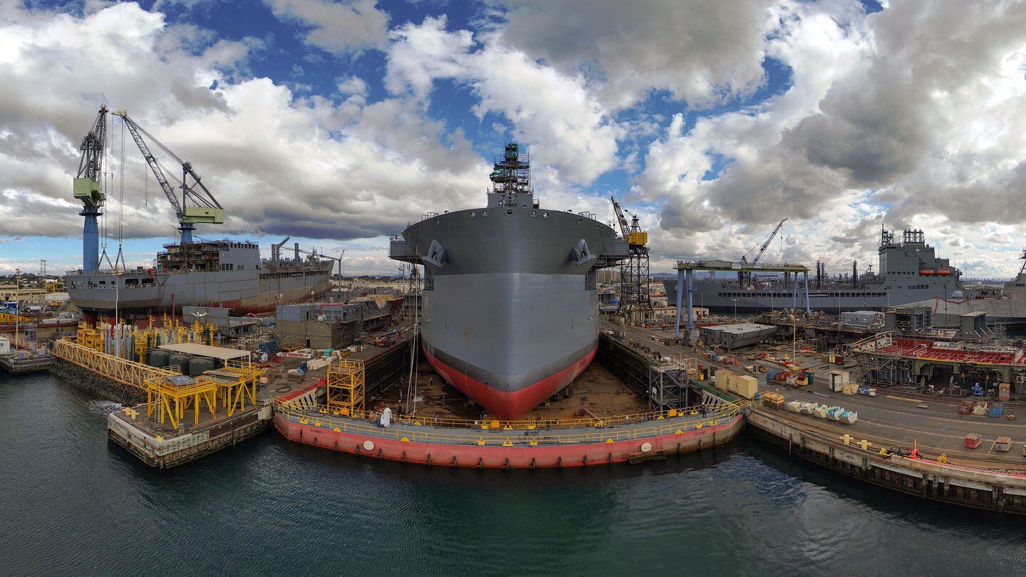 A December 2023 panoramic photo of the General Dynamics' NASSCO shipyard shows Expeditionary Sea Base Robert Simanek, center, as well as oiler construction and Navy ship repair work across the waterfront. (Photo courtesy NASSCO)