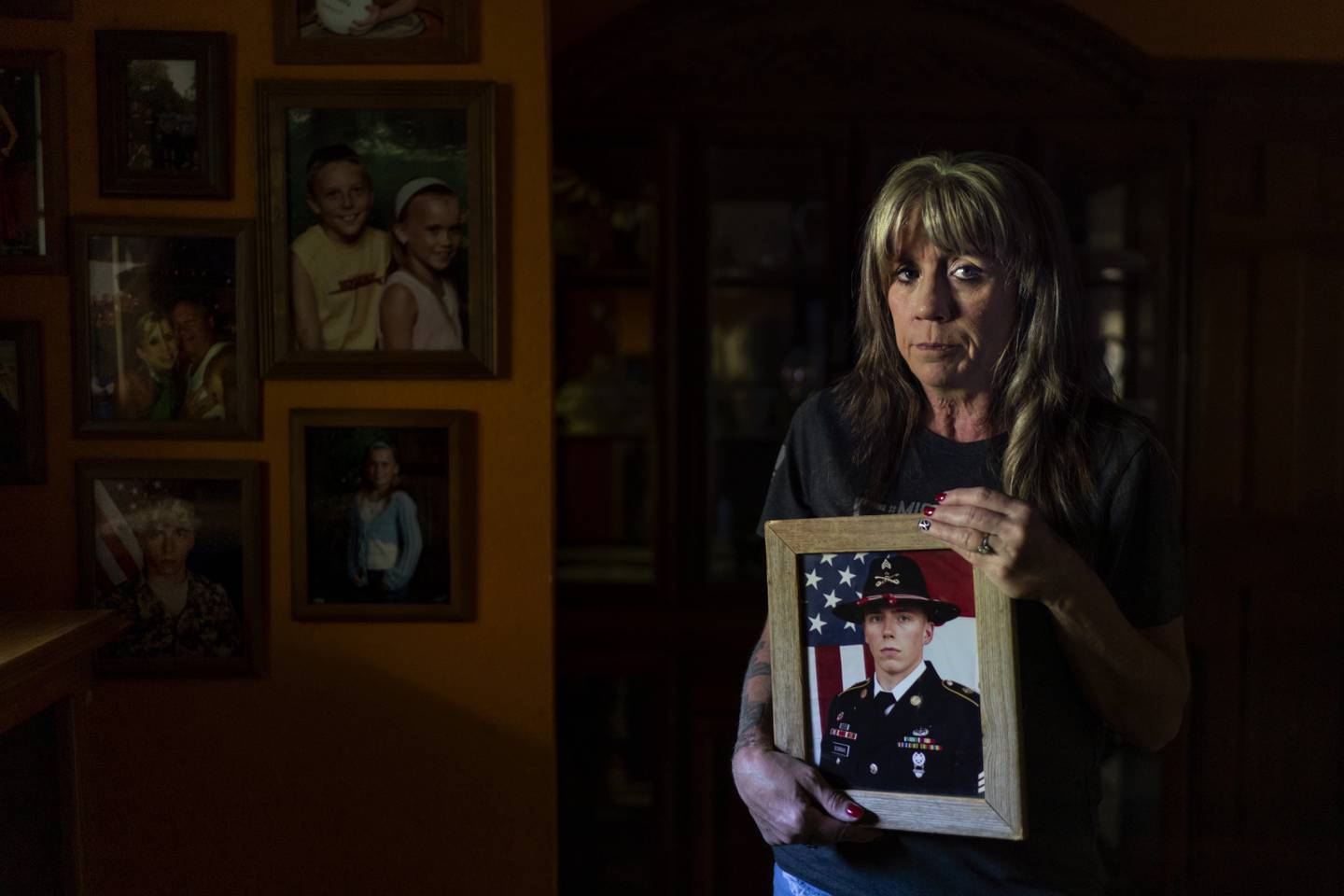 Barbie Rohde holds a photo of her son, Army Sgt. Cody Bowman, at her home Sunday, June 11, 2023, in Flint, Texas.