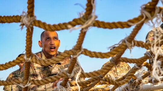 A soldier with the Guam National Guard assigned to the Multinational Force and Observers prepares to climb an obstacle during the MFO Force Skills Competition in South Camp, Egypt, Feb. 18, 2020. (Staff Sgt. Eliverto Larios/DoD)
