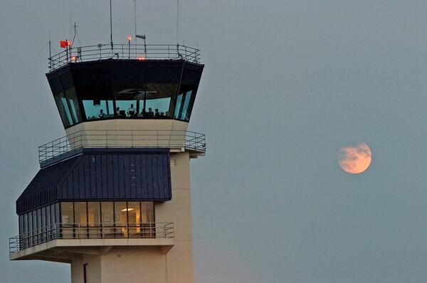 A full moon rises behind the Naval Air Station Oceana control tower. (PH2 Daniel J. McLain/Navy)