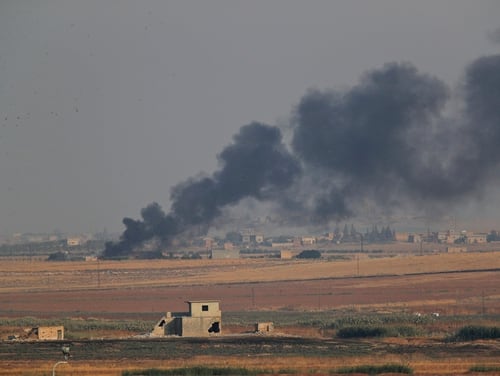 In this photo taken from the Turkish side of the border between Turkey and Syria, in Akcakale, Sanliurfa province, southeastern Turkey, smoke billows from a fire inside Syria during bombardment by Turkish forces Wednesday, Oct. 9, 2019. (Lefteris Pitarakis/AP)