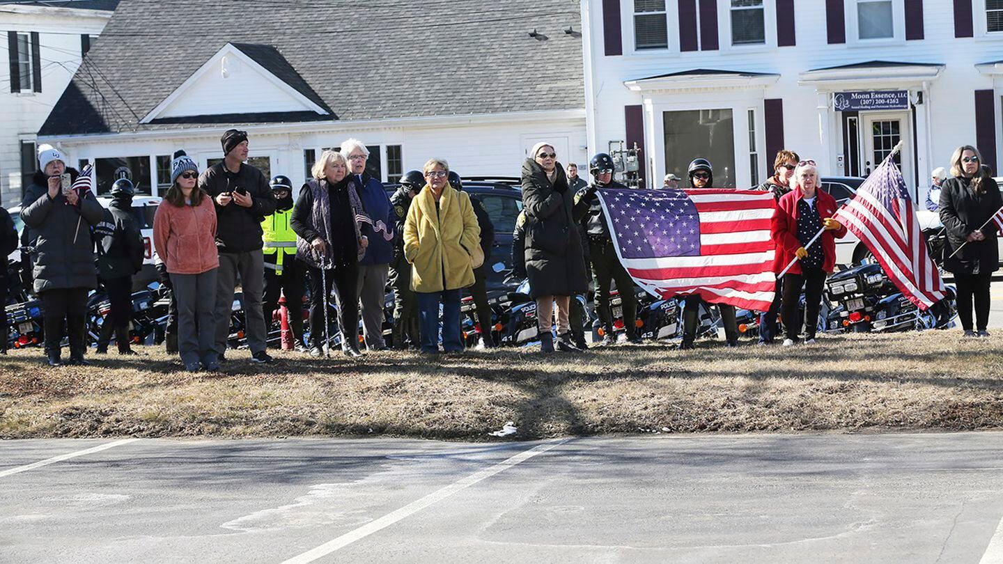 People gather outside Wiggin-Purdy-McCooey-Dion Funeral Home in Dover, New Hampshire as the body of Marine Capt. Jack Casey, arrives on Feb. 20. (Deb Cram/Foster's Daily Democrat via AP)