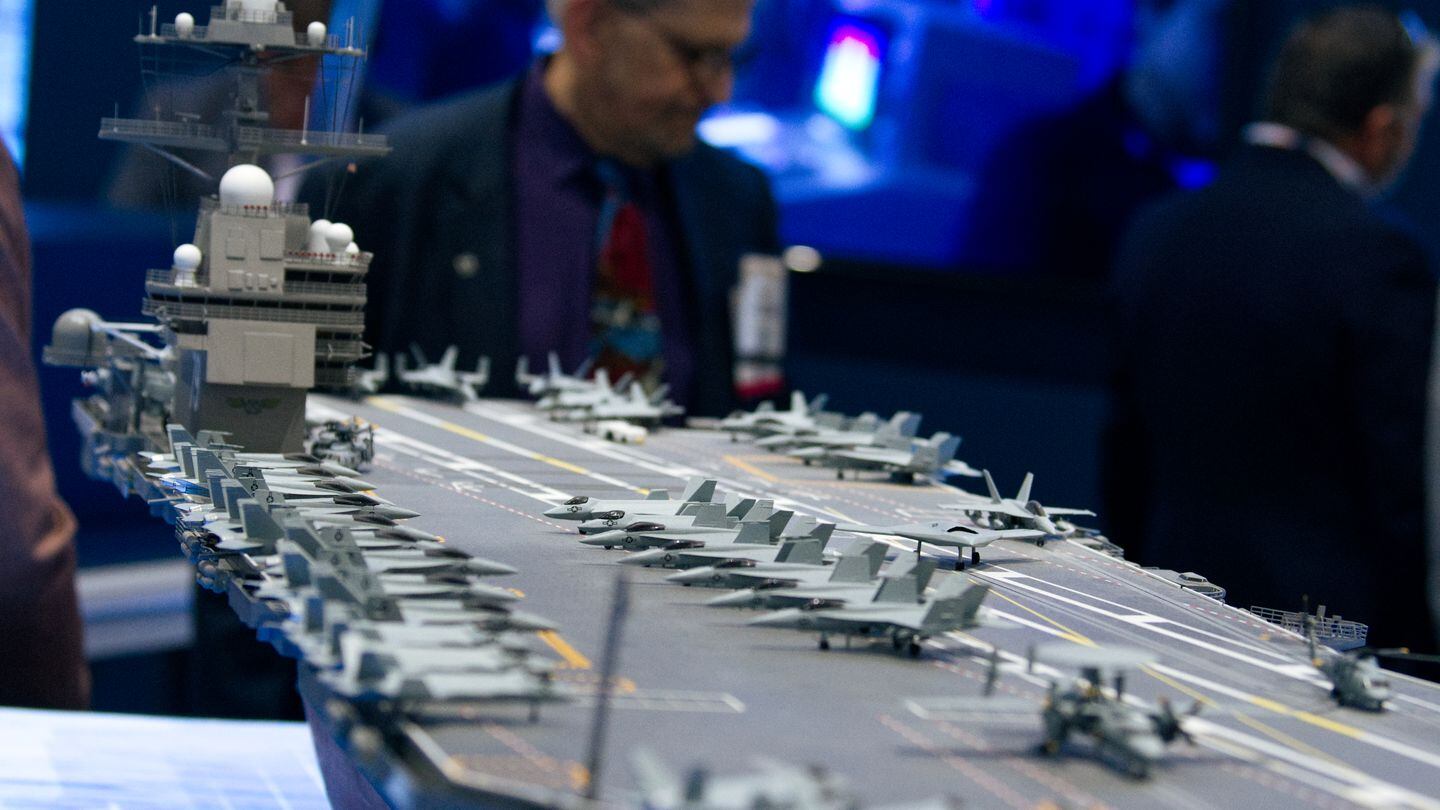 A model aircraft carrier is displayed at defense contractor HII's booth at the West conference in San Diego. (Colin Demarest/C4ISRNET)
