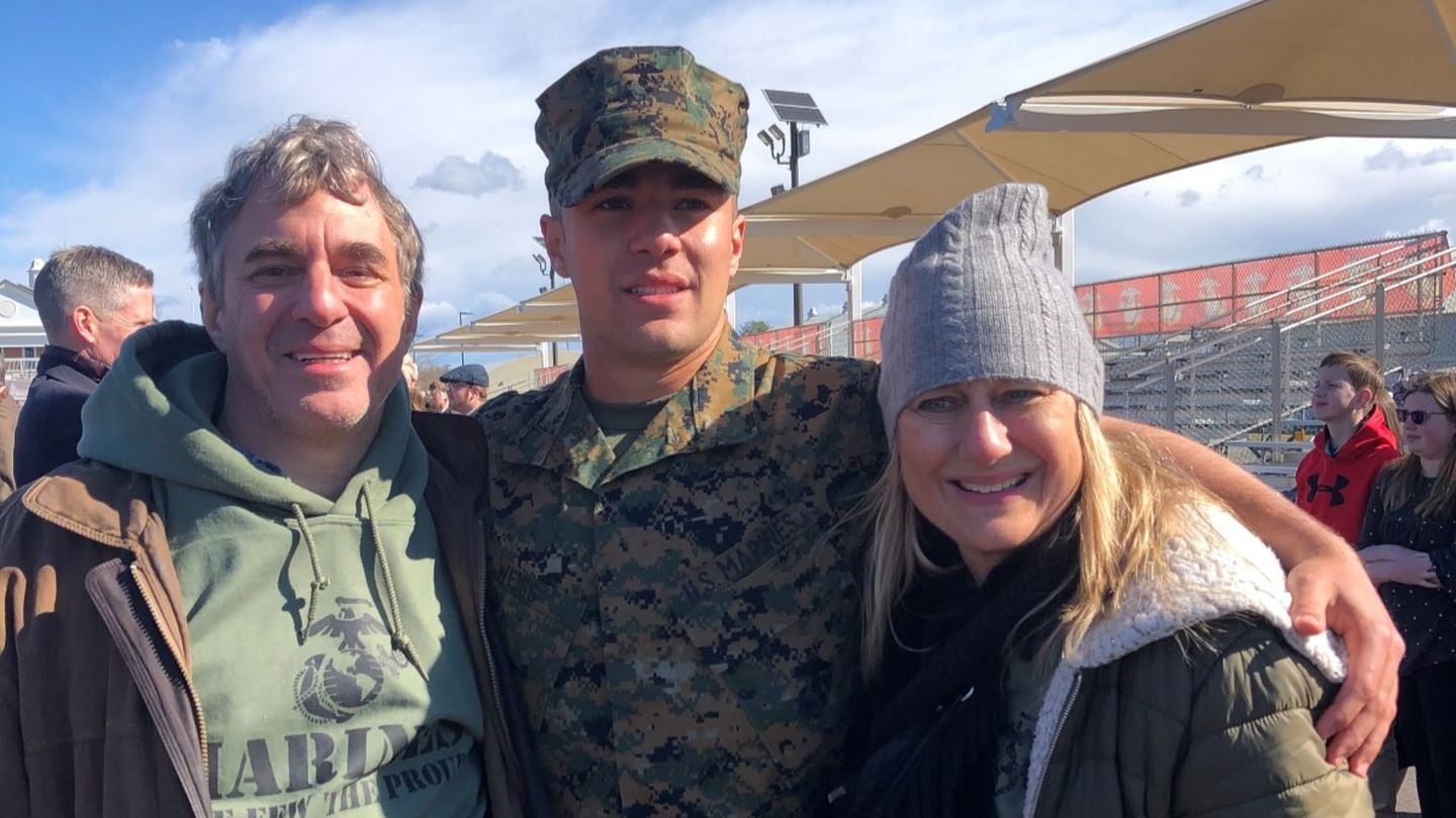 Marine 2nd Lt. Matthew Weiss, center, and his parents pose for a photo right after his graduation from Officer Candidates School at Marine Corps Base Quantico, Virginia, March 26, 2022. (2nd Lt. Matthew Weiss/Marine Corps)