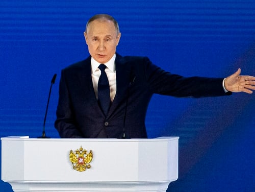 Russian President Vladimir Putin gestures as he gives his annual state of the nation address in Manezh, Moscow, April 21, 2021. (Alexander Zemlianichenko/AP)