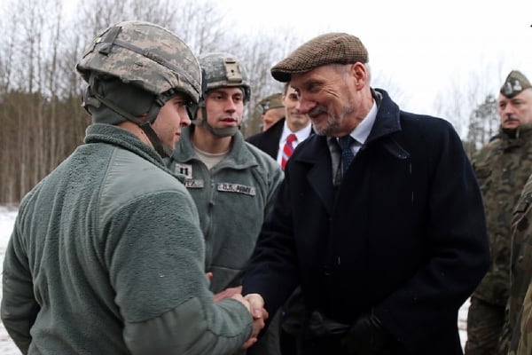 Then Polish defense minister, Antoni Macierewicz, shakes hands with soldiers in a Patriot unit. Macierewicz was working to finalize a deal to buy Patriot systems from the U.S. government when he visited the 5th Battalion, 7th Air Defense Artillery Brigade in Poland to view 5-7 ADA's M901 Patriot Launching Stations. Macierewicz was replaced as defense minister in January 2018. (Photo by Sgt. Paige Behringer/10th Press Camp Headquarters)