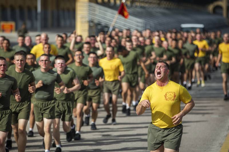New Marines with Echo Company, 2nd Recruit Training Battalion, participate in a motivational run at Marine Corps Recruit Depot San Diego, Feb. 4, 2021.
