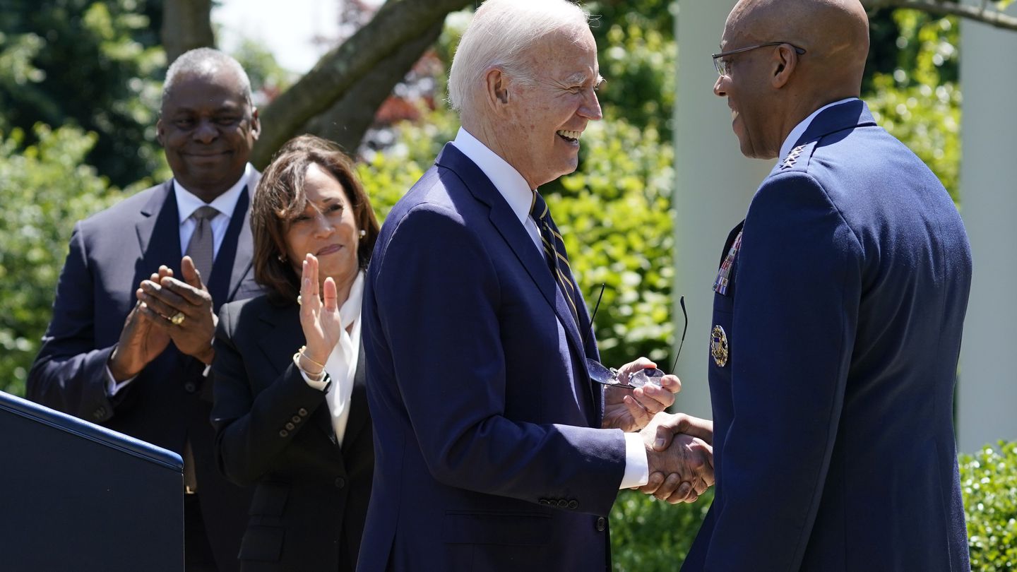 President Joe Biden shakes hands with U.S. Air Force Chief of Staff Gen. CQ Brown Jr. after announcing his intent to nominate Brown to serve as the next chairman of the Joint Chiefs of Staff on May 25. Defense Secretary Lloyd Austin and Vice President Kamala Harris applaud.  (Evan Vucci/AP)
