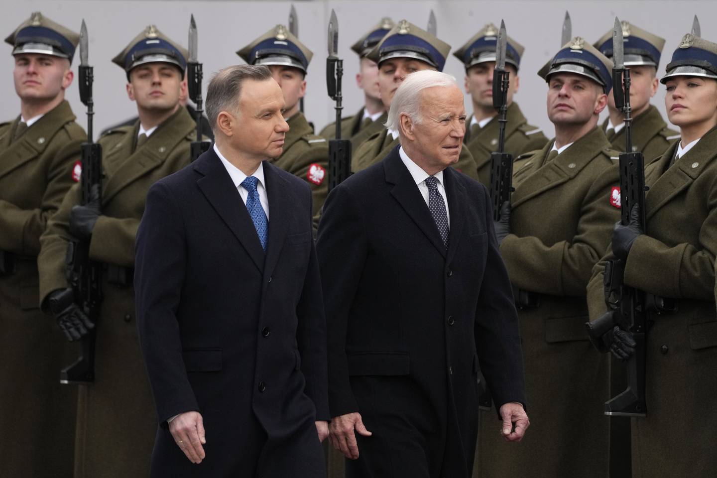 Polish President Andrzej Duda, left, welcomes President Joe Biden at the Presidential Palace in Warsaw, Ukraine, Tuesday, Feb. 21, 2023.
